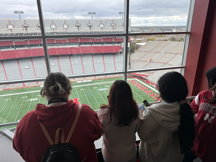 Students looking down on a football field