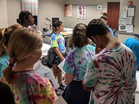 Students on tour wearing tie dye shirts