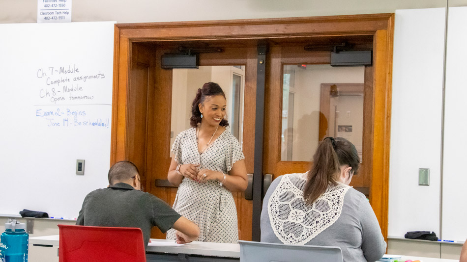 Students in a classroom with Marianna Burks