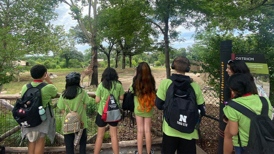 TRIO ETS students watch a giraffe at the zoo